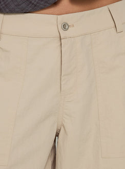 Highlighting the Relaxer 3/4 Cargo Pants Beige in womens regular pants with mid-rise waistband detail Princess Polly