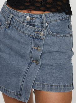   side view of model wearing Princess Polly Denis Mini Denim Skirt Light Blue Mini Skirts Skirts 