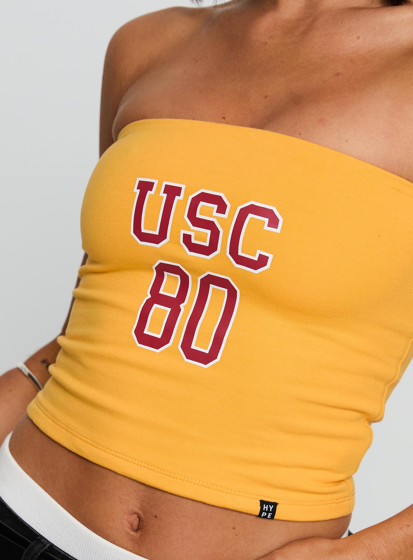 back view of model wearing Princess Polly USC Tube Top Gold Sleeveless straight 