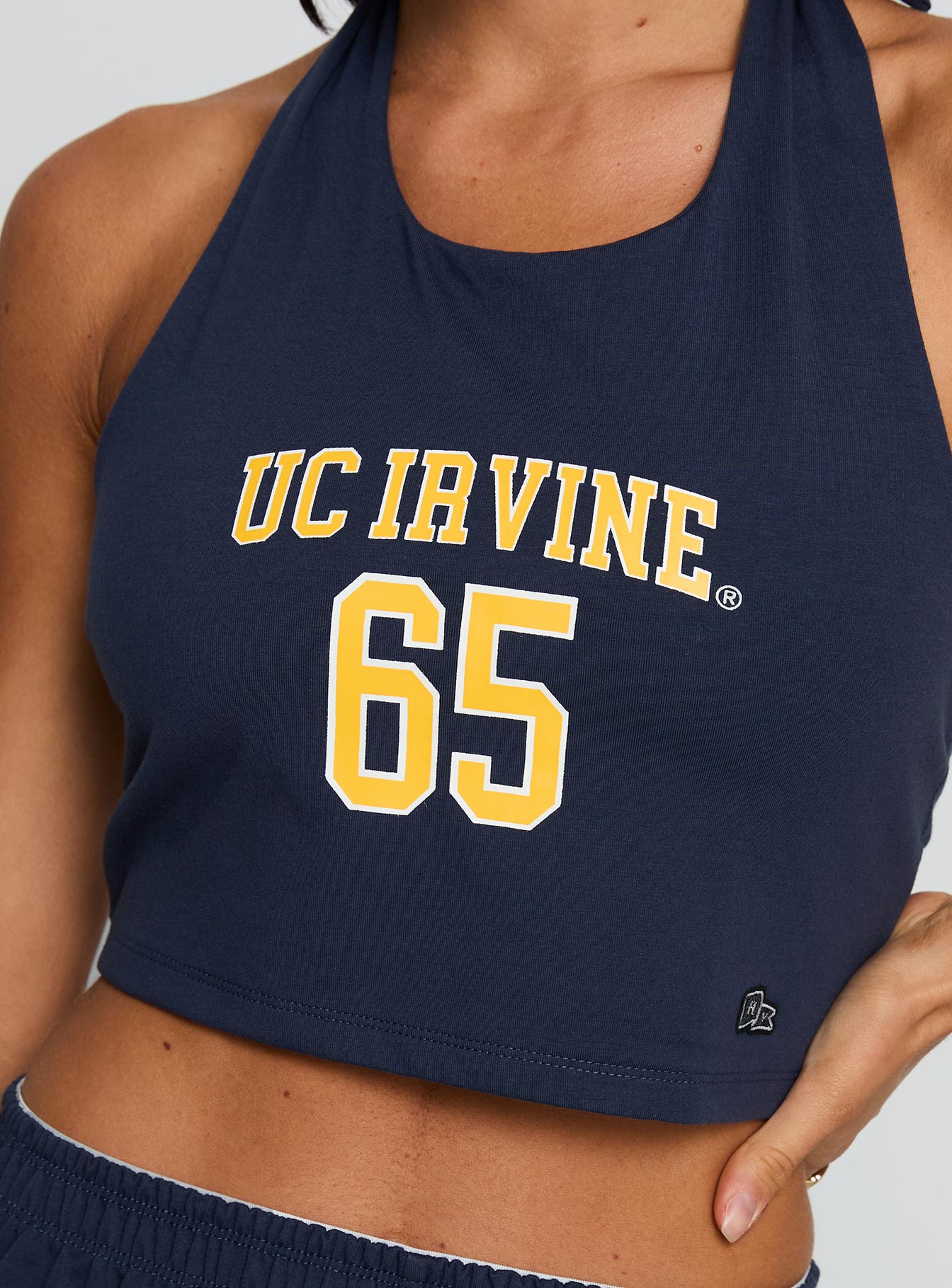 back view of model wearing Princess Polly UC Irvine Tailgate Halter Top Blue Sleeveless Scoop Neck 