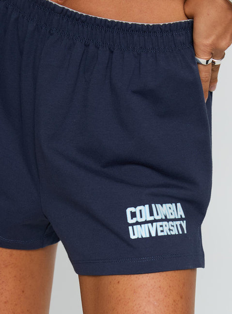 back view of model wearing Princess Polly Columbia Soffee Shorts Navy 