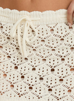 Shop the Harrietah Crochet Tie Waist Mini Skirt in white, featuring intricate lace detailing and a fitted aline silhouette with mini length Princess Polly