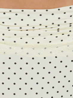 Highlighting the lace hem detail of Zespri Jersey Maxi Skirt Cream Polka Dot womens-skirts in ivory and black Princess Polly