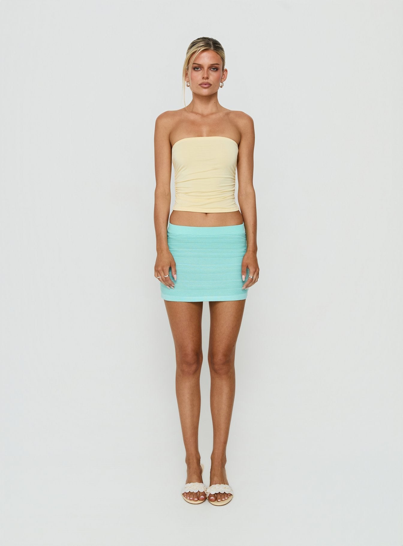 Featuring the Qwin Knit Mini Skirt in Aqua womens-skirts with mini length front view of model wearing Princess Polly