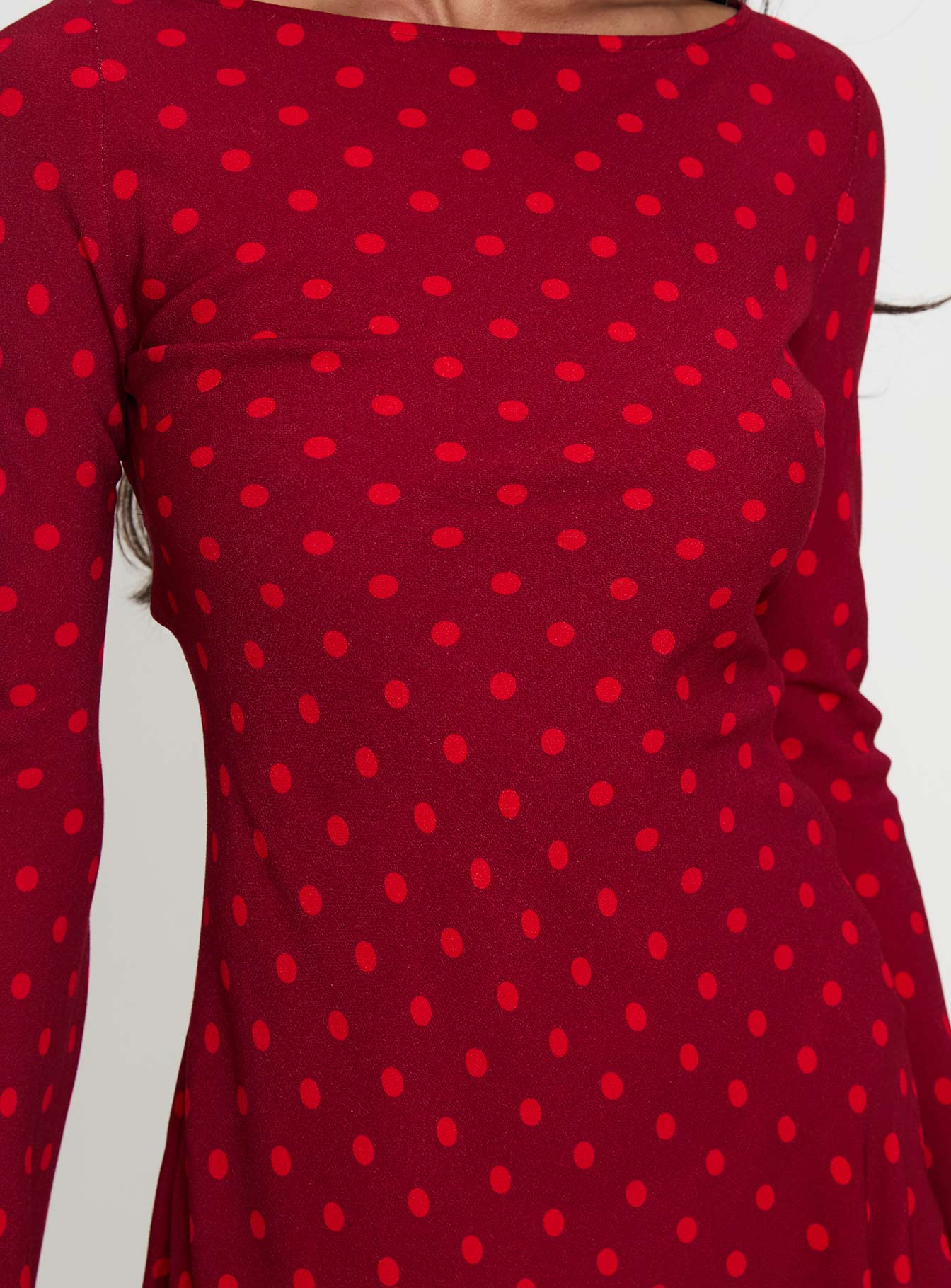 back view of model wearing Princess Polly Good Graces Long Sleeve Mini Dress Red Dot Boat Neck 