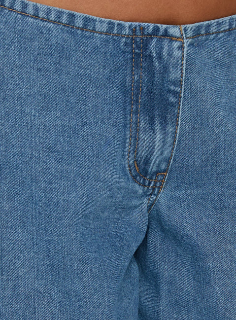 Featuring the Hereos Mid Rise Baggy Leg Jeans in Bright Blue Wash, womens jeans designed with mid-rise waist and belt, product Princess Polly