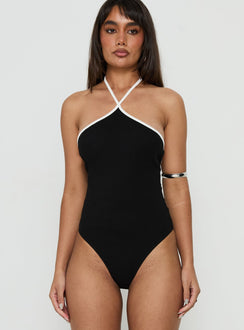 Showcasing the Azara Contrast Arrowneck Bodysuit Black / White womens-bodysuit with sleeveless design front view of model wearing Princess Polly