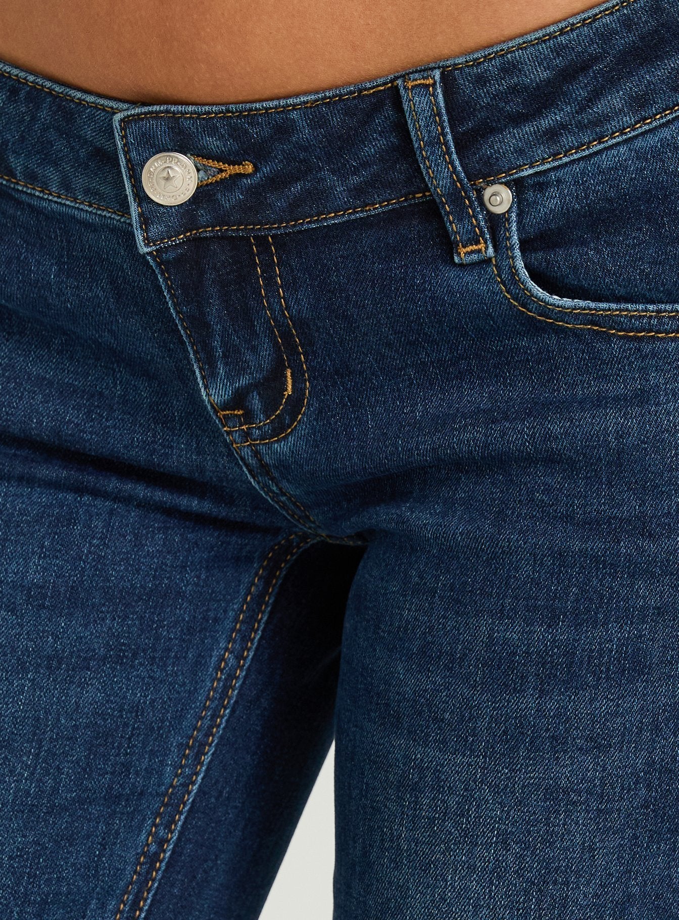 Naketa Ultra Low Rise Bootleg Jeans Mid Blue Wash