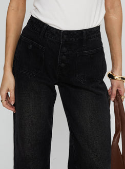 back view of model wearing Princess Polly Carianne Low Rise Wide Leg Jeans Washed Black Mid Rise Jeans 