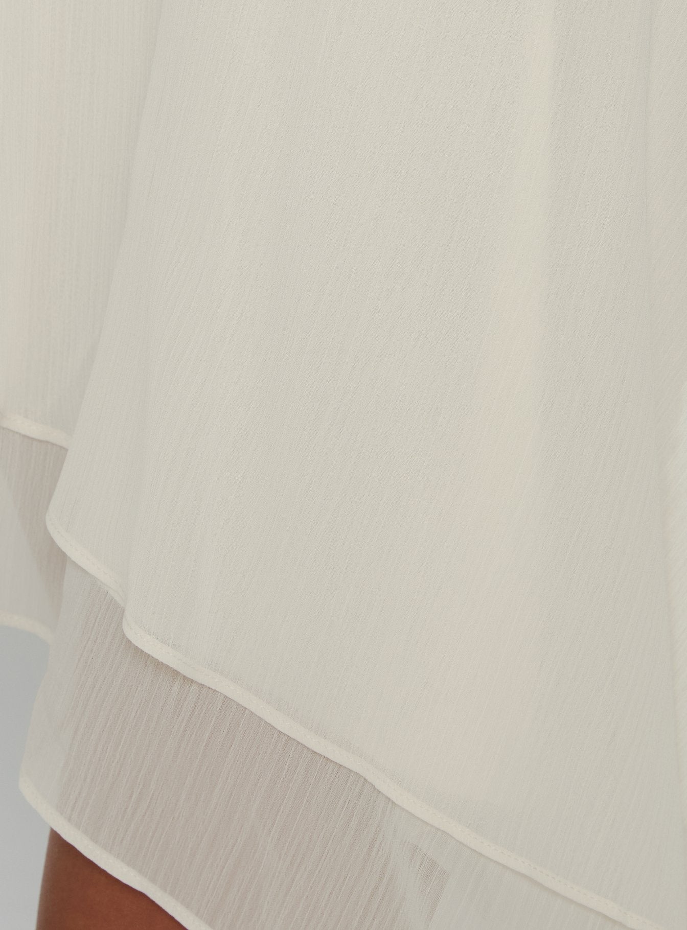 Highlighting the Gemmina Asymmetrical Chiffon Mini Skirt in womens-skirts with mini length Princess Polly