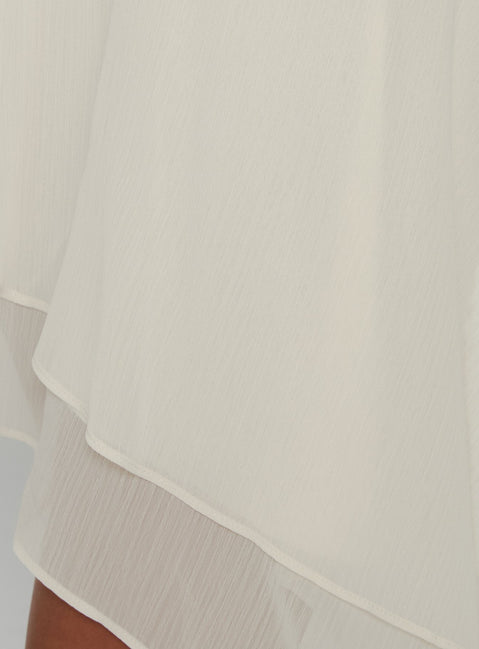 Highlighting the Gemmina Asymmetrical Chiffon Mini Skirt in womens-skirts with mini length Princess Polly
