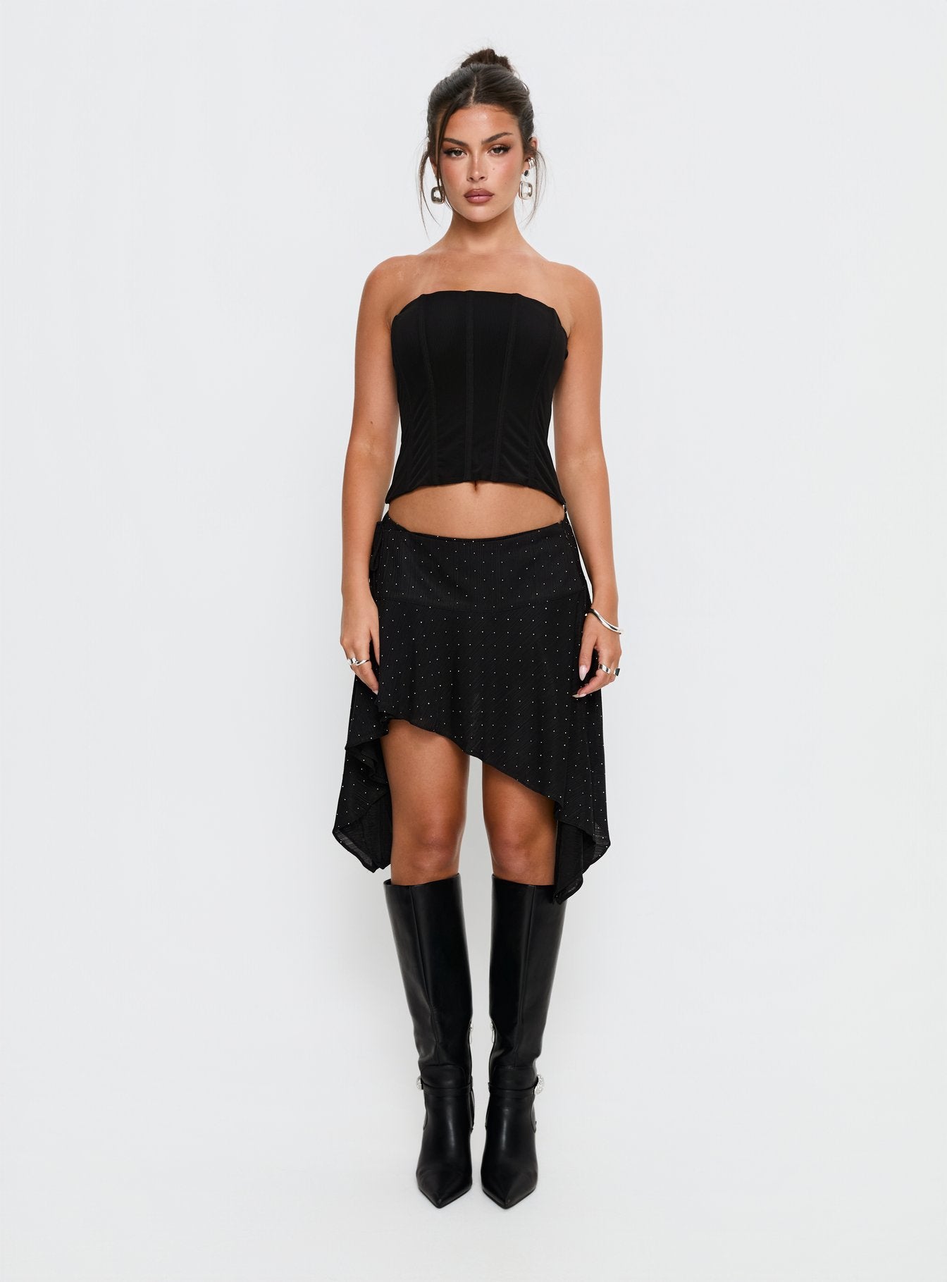   side view of model wearing Princess Polly Hevenna Asymmetrical Plisse Mini Skirt Black Diamante Mini Skirts 