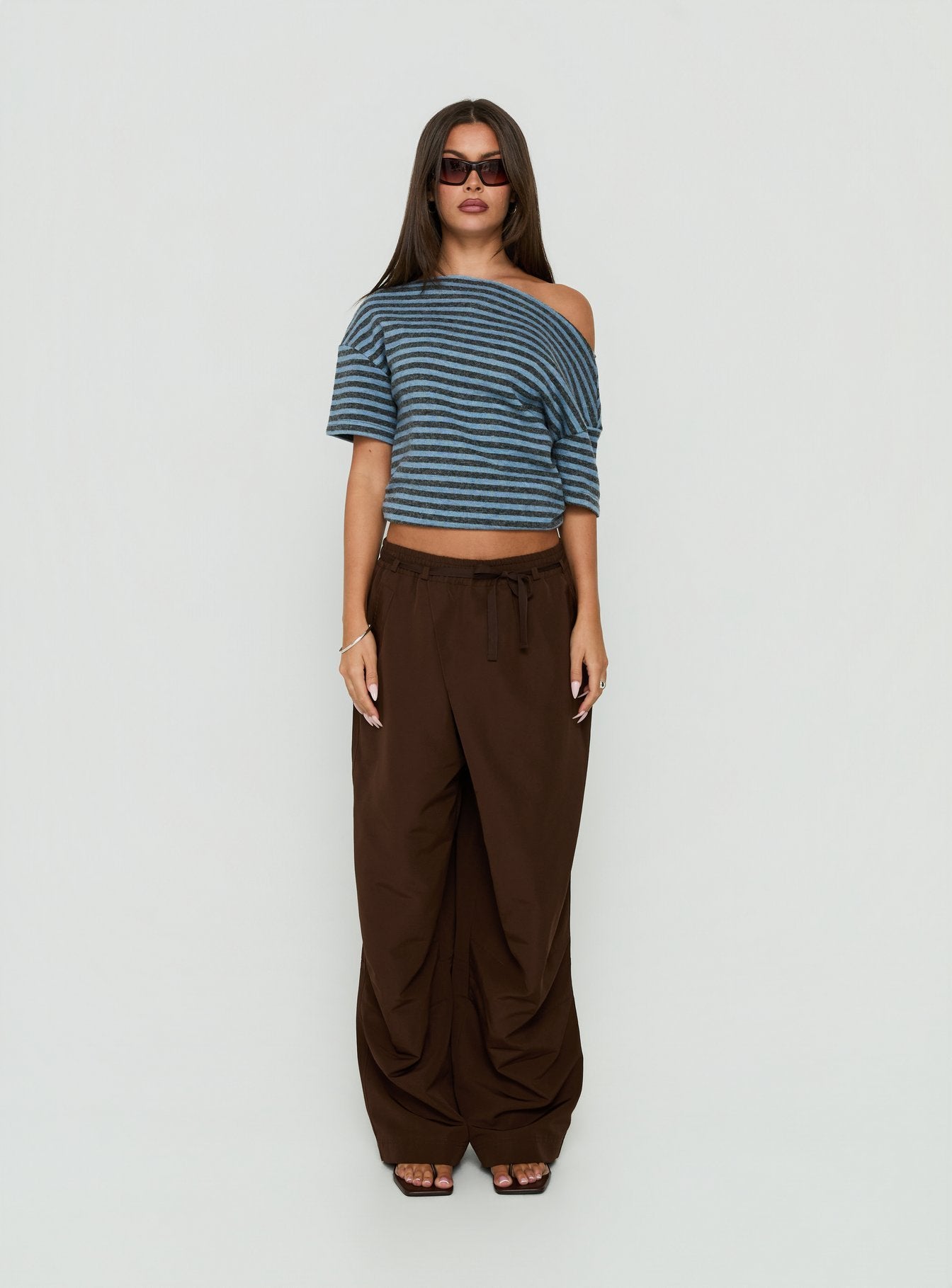 Presenting the Signora Elasticated Waist Pants Chocolate womens-regular-pants in high-rise wide-leg silhouette front view of model wearing Princess Polly