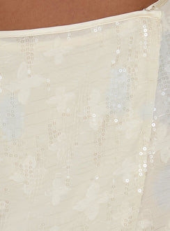 Showcasing the Brittain Wrap Mini Skirt Cream womens-skirts with mini length detail Princess Polly