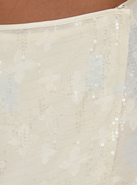 Showcasing the Brittain Wrap Mini Skirt Cream womens-skirts with mini length detail Princess Polly