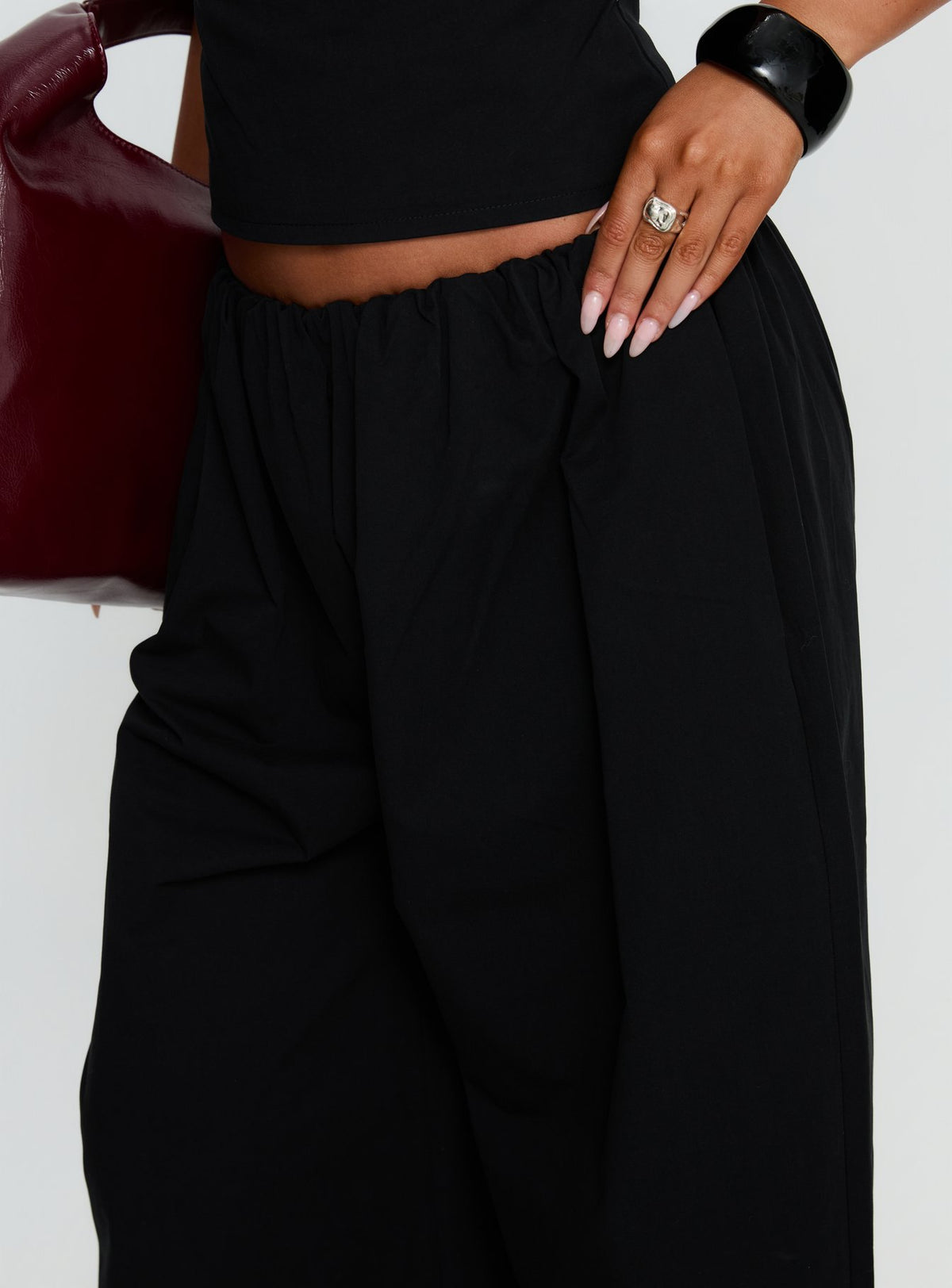 side view of model wearing Princess Polly Tidekiss Pants Noir Mid Rise Pants 