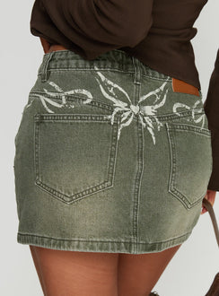  side view of model wearing Princess Polly Laynee Butterfly Mini Skirt Washed Green Mini Skirts 
