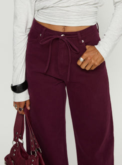 back view of model wearing Princess Polly Bruiser Tie Waist Mid Rise Wide Leg Jeans Currant High Rise Jeans 
