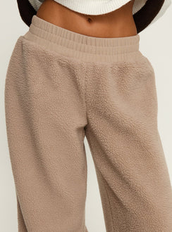 back view of model wearing Princess Polly Siberia Fleece Track Pant Light Brown High Rise Pants 