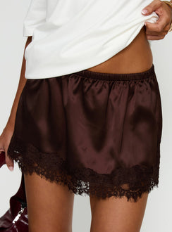   side view of model wearing Princess Polly Orlynn Satin Lace Trim Mini Skirt Brown Mini Skirts 