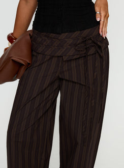 side view of model wearing Princess Polly Seneca Wrap Pant Brown Stripe Mid Rise Pants 