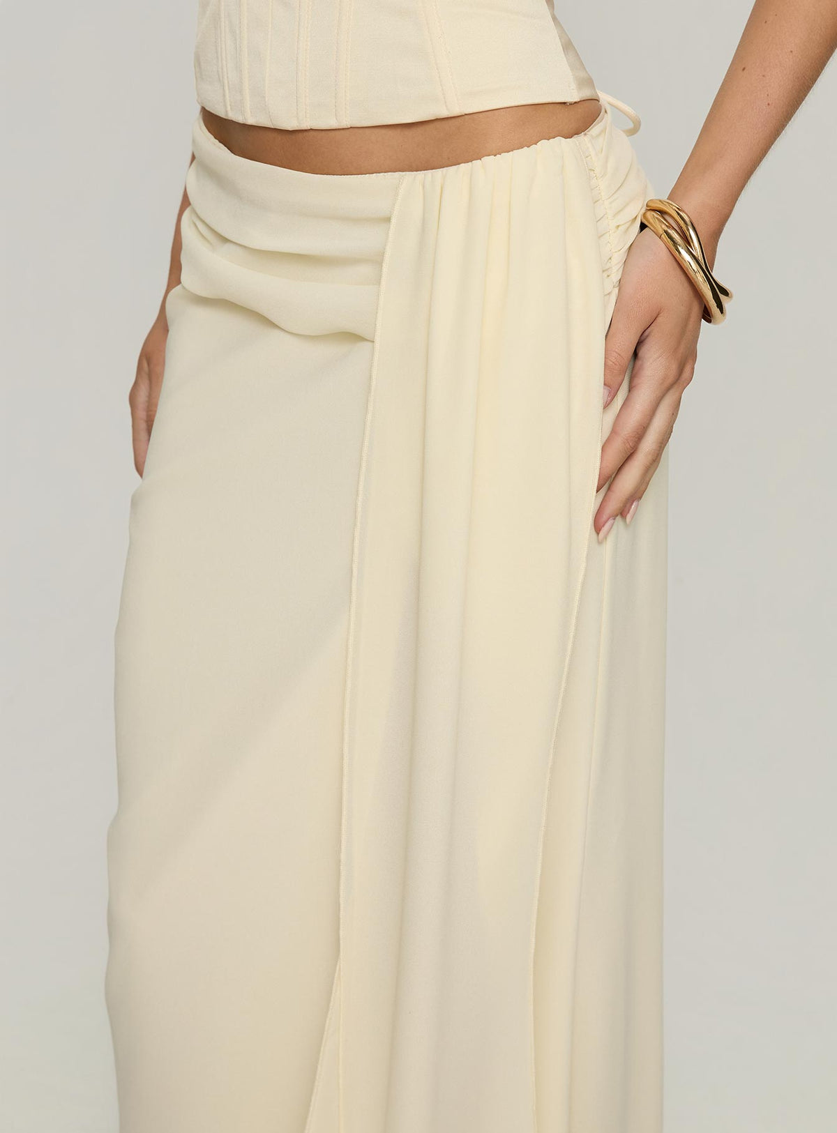 back view of model wearing Princess Polly Holliann Draped Maxi Skirt Butter Maxi Skirts 