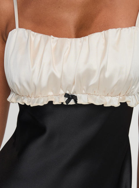 back view of model wearing Princess Polly Cacciatore Mini Dress Black / Cream Sweetheart Neckline 