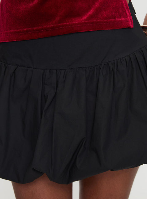 back view of model wearing Princess Polly Marentino Bubble Hem Mini Skirt Black Mini Skirts 