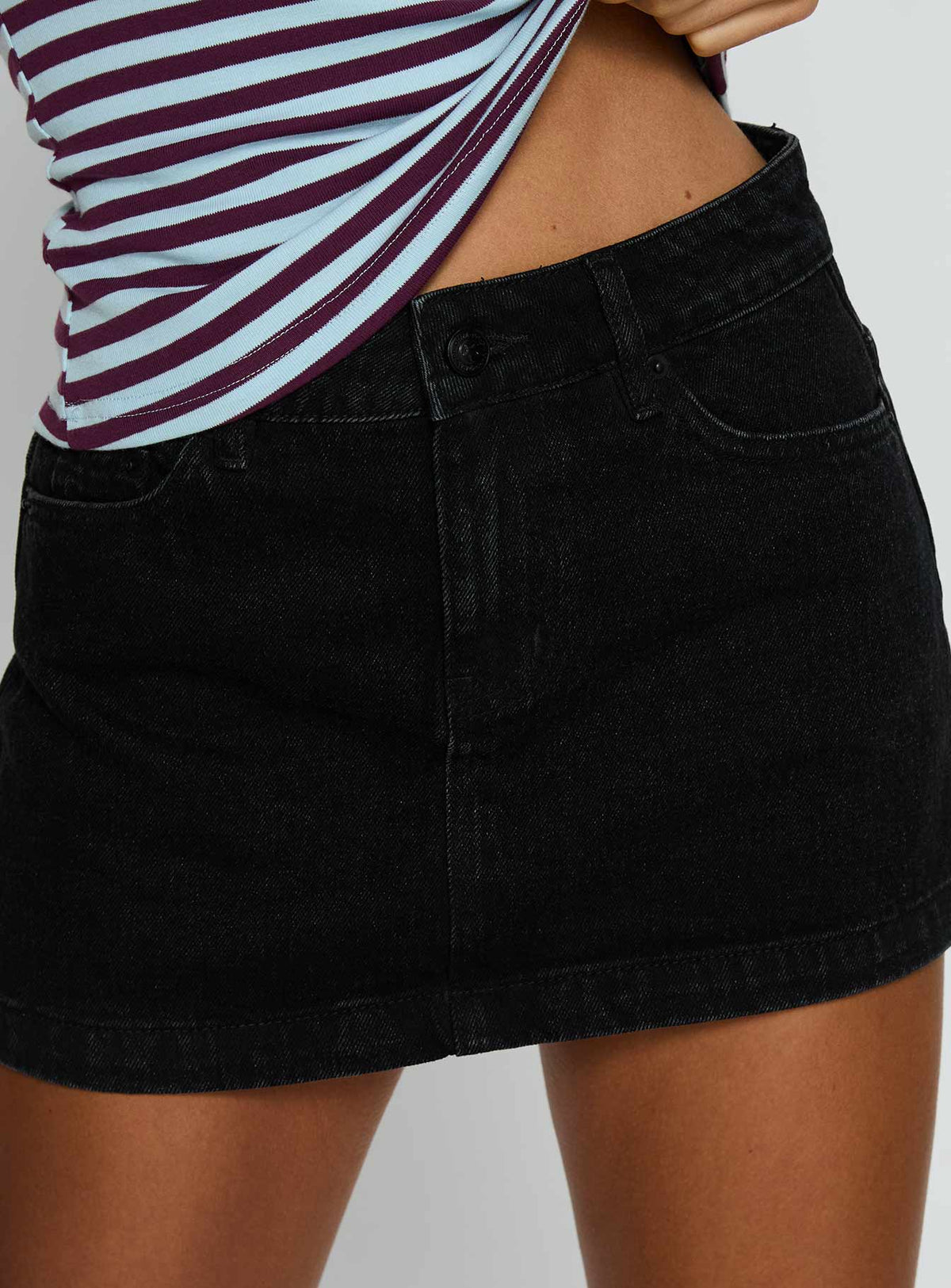 back view of model wearing Princess Polly Nicolina Low Rise Denim Mini Skirt Washed Black Mini Skirts 