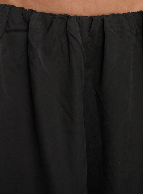 side view of model wearing Princess Polly Odara Wide Leg Pants Black Low Rise Pants 