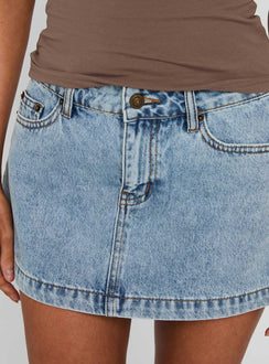 back view of model wearing Princess Polly Nicolina Low Rise Denim Mini Skirt Ice Blue Wash Tall Mini Skirts Skirts 