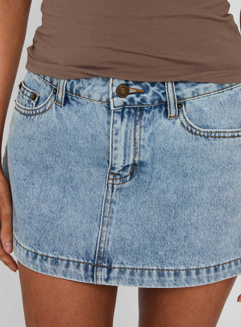 back view of model wearing Princess Polly Nicolina Low Rise Denim Mini Skirt Ice Blue Wash Tall Mini Skirts Skirts 