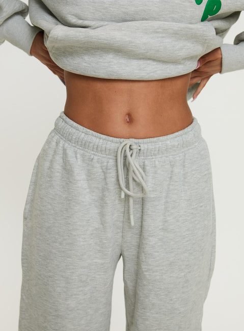 back view of model wearing Princess Polly Princess Polly Wide Leg Track Pant Bubble Text Grey Marle / Green Pants 