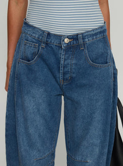 back view of model wearing Princess Polly Normana Mid Rise Cropped Barrel Jeans Mid Blue Wash Mid Rise Jeans 