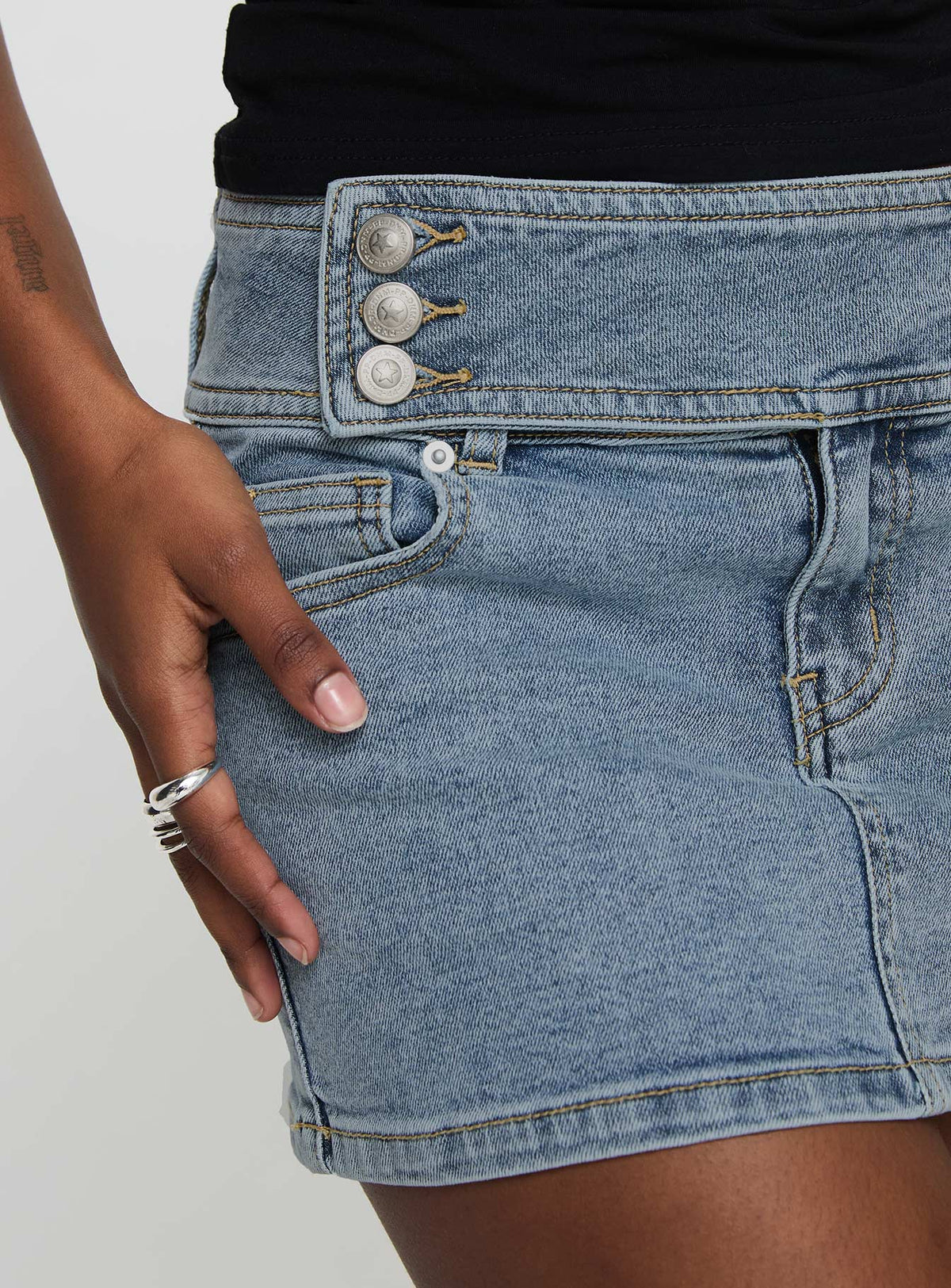 back view of model wearing Princess Polly Brinkman Mini Skirt Light Wash Denim Mini Skirts 