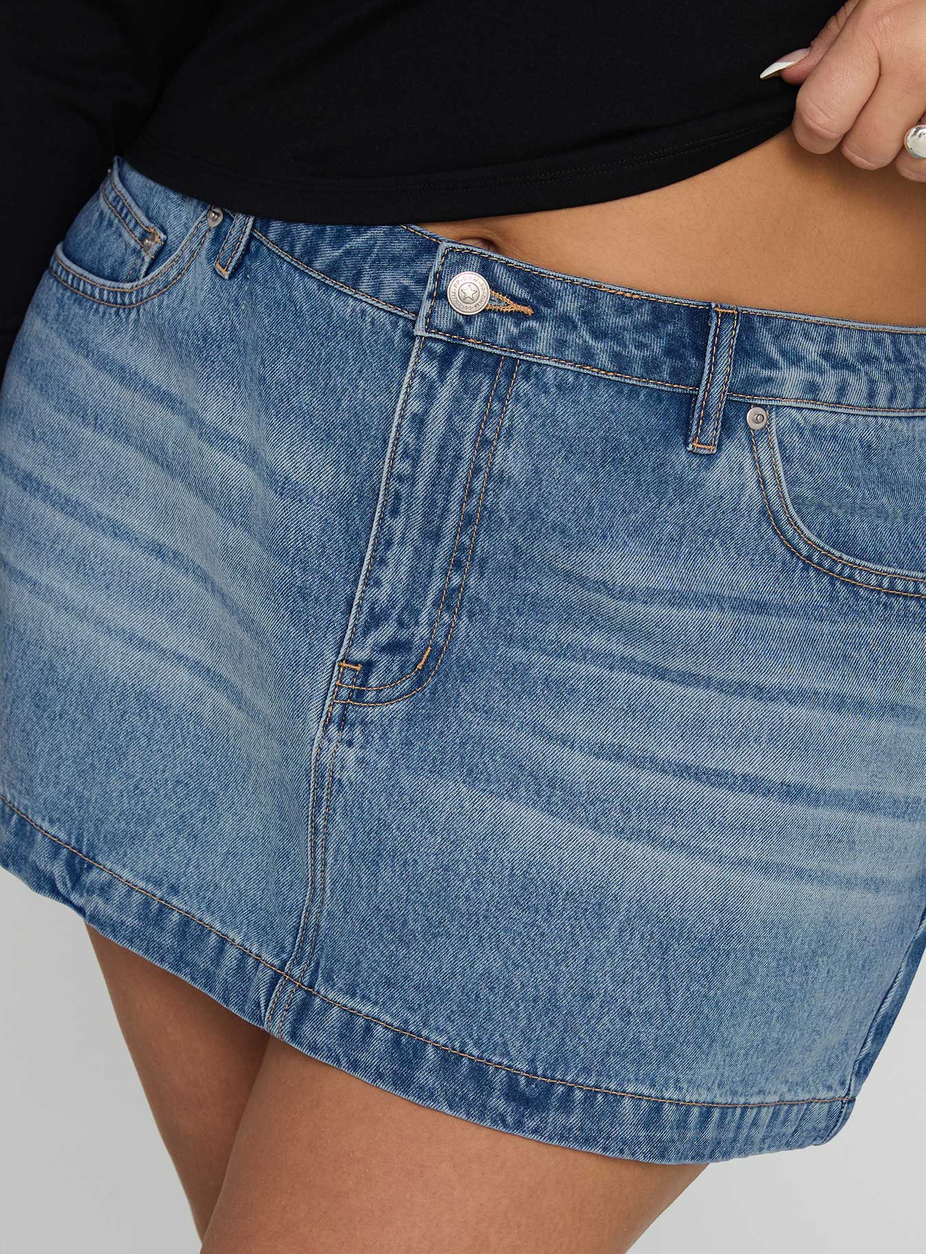 back view of model wearing Princess Polly Fossils Denim Mini Skirt Blue Curve Mini Skirts 