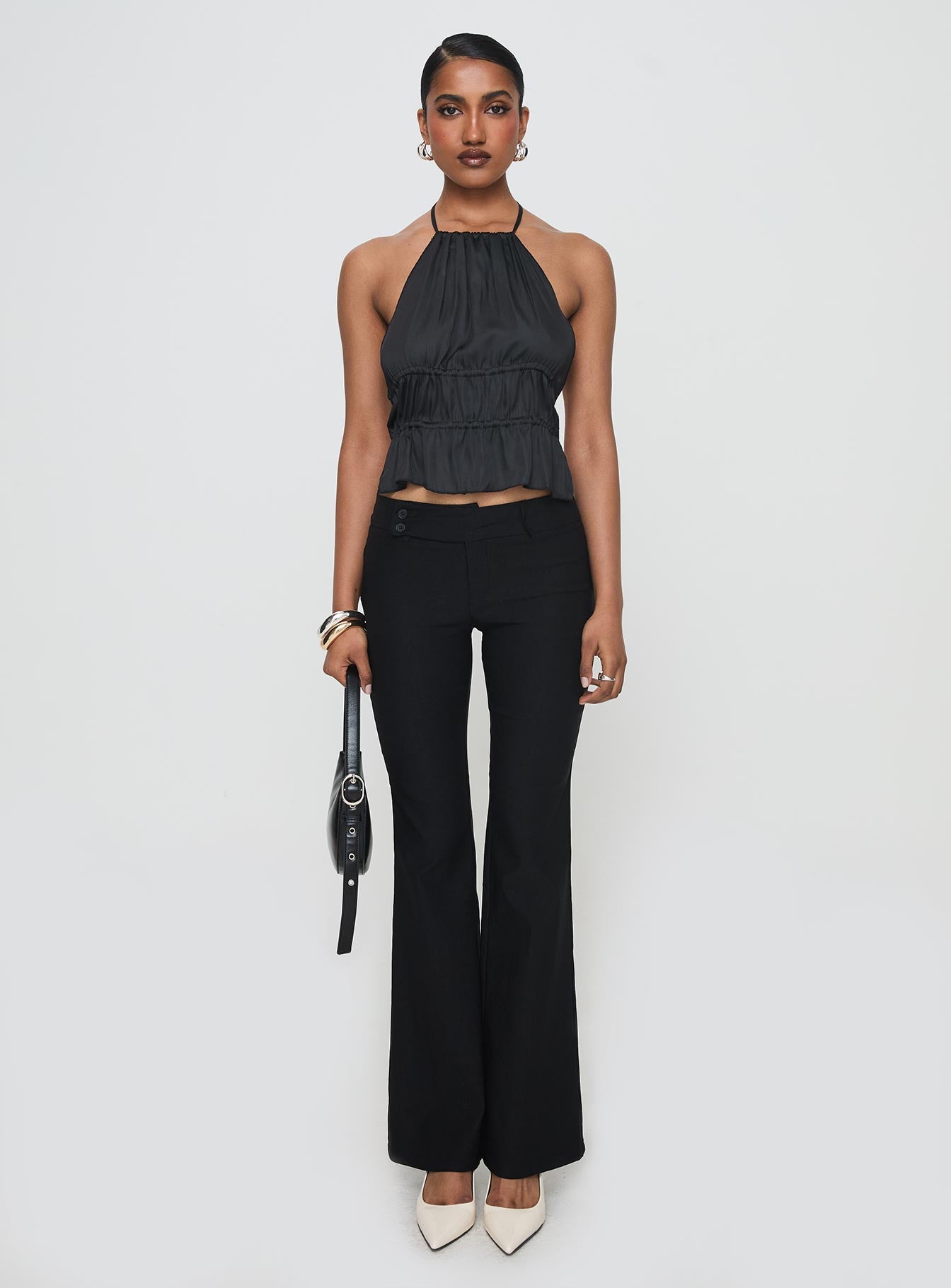 front view of model wearing Princess Polly Legacy Halter Top Onyx Sleeveless High Neck 