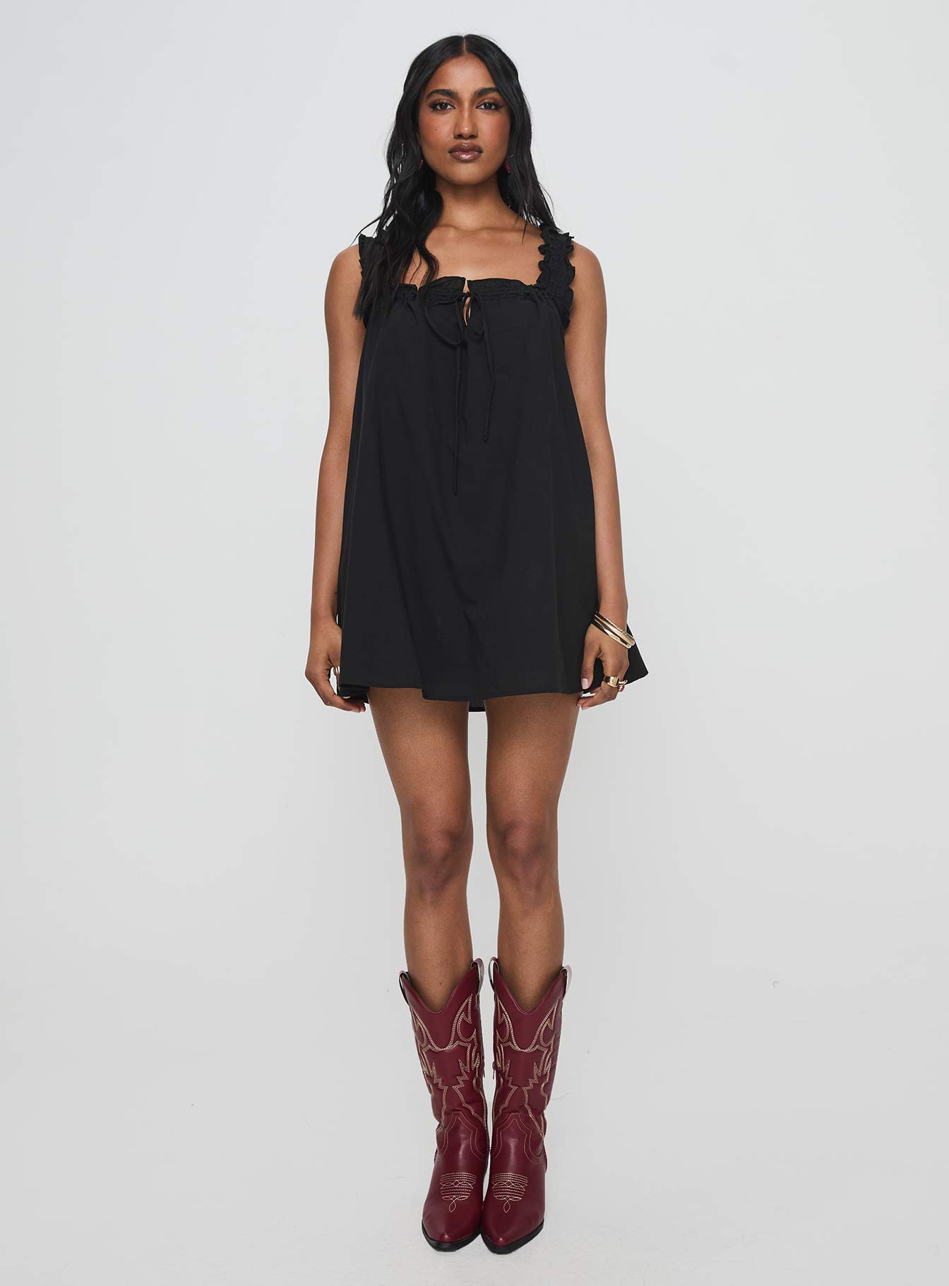 front view of model wearing Princess Polly Swing Mini Dress Black Petite Square Neck 