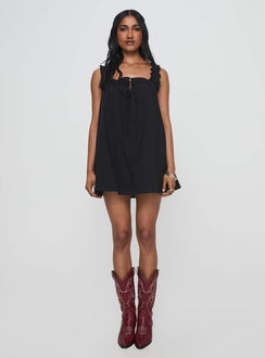 front view of model wearing Princess Polly Swing Mini Dress Black Petite Square Neck 