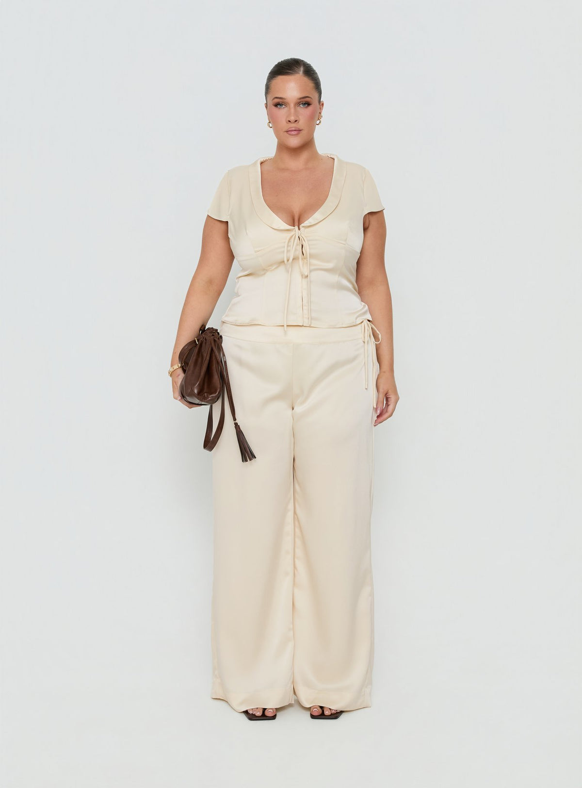 Discover the Aubrette Satin Tie Pants Cream Curve in womens-regular-pants with high-rise and wide-leg silhouette front view of model wearing Princess Polly