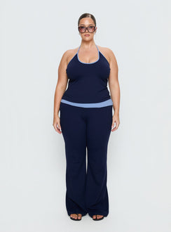 front view of model wearing Princess Polly Kobee Jersey Flare Pants Navy / Light Blue Curve High Rise Pants 