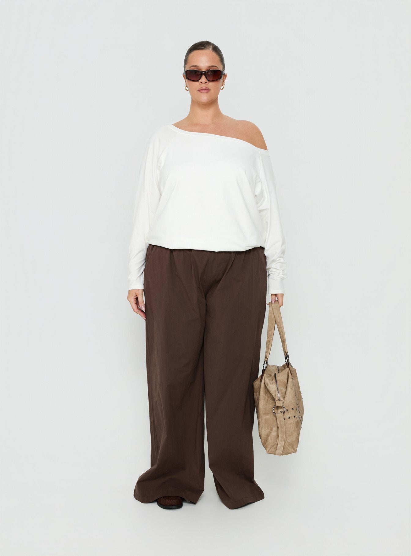 Showcasing the Lunea Concealed Waistband Pants Brown Curve in womens regular pants with high-rise styling front view of model wearing Princess Polly