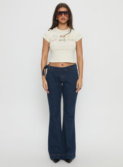 front view of model wearing Princess Polly Acapulco Low Rise Flare Jeans Dark Blue Wash Low Rise Jeans Jeans 