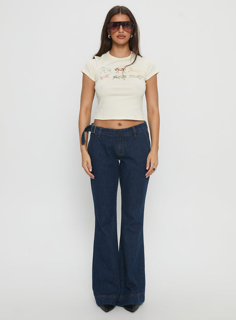 front view of model wearing Princess Polly Acapulco Low Rise Flare Jeans Dark Blue Wash Low Rise Jeans Jeans 