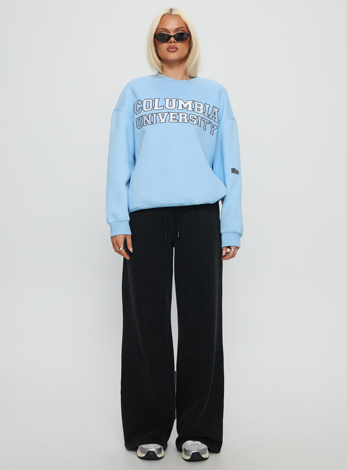 side view of model wearing Princess Polly Columbia Offside Crewneck Sweatshirt Blue Long 