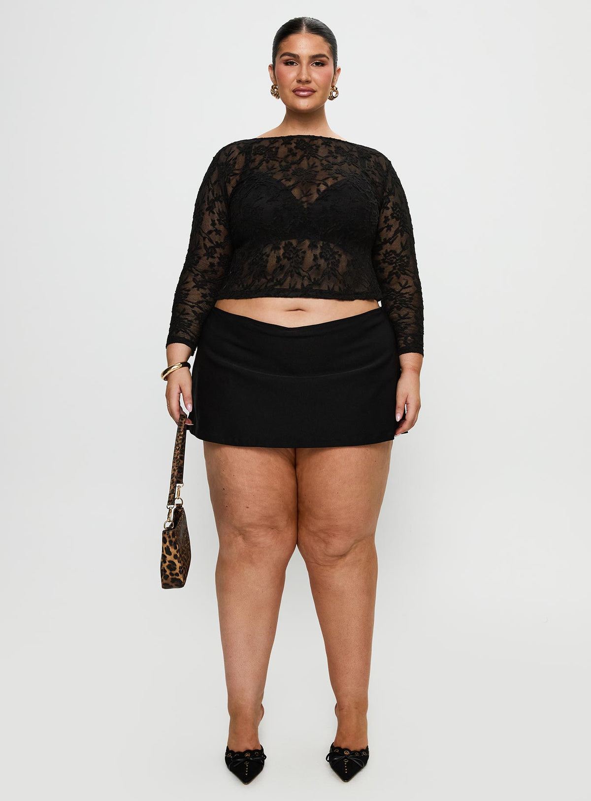 side view of model wearing Princess Polly Martine Sheer Top Black Curve Full Sleeves Boat Neck 