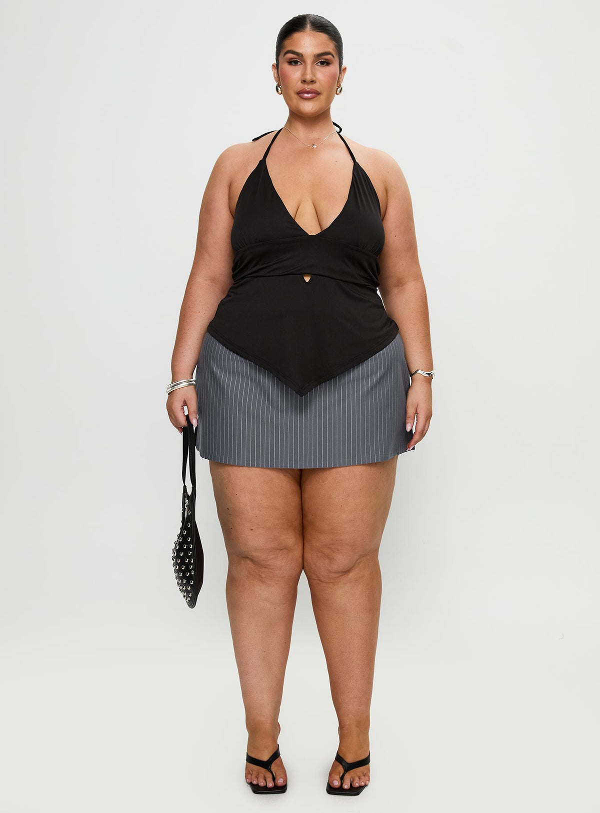 front view of model wearing Princess Polly Averee Halter Top Black Curve Sleeveless Plunger 