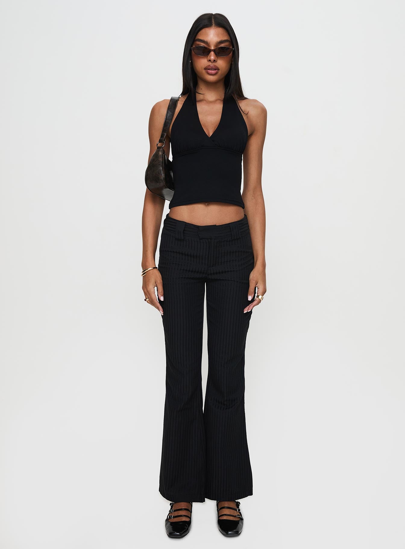 side view of model wearing Princess Polly Jinxed Pant Black Low Rise Pants Pants 