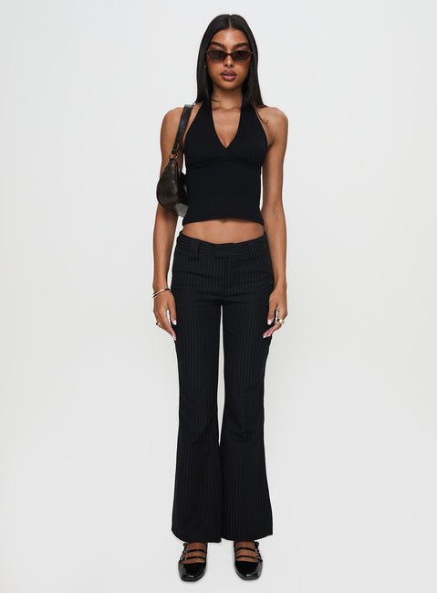side view of model wearing Princess Polly Jinxed Pant Black Low Rise Pants Pants 