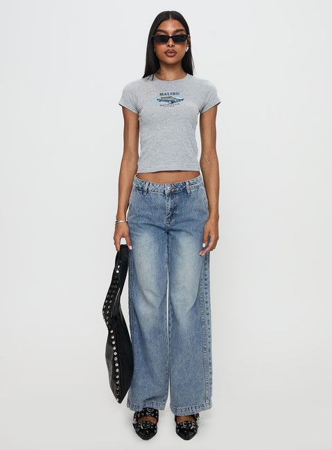 front view of model wearing Princess Polly Skipper Low Rise Baggy Jeans Vintage Blue Low Rise Jeans 